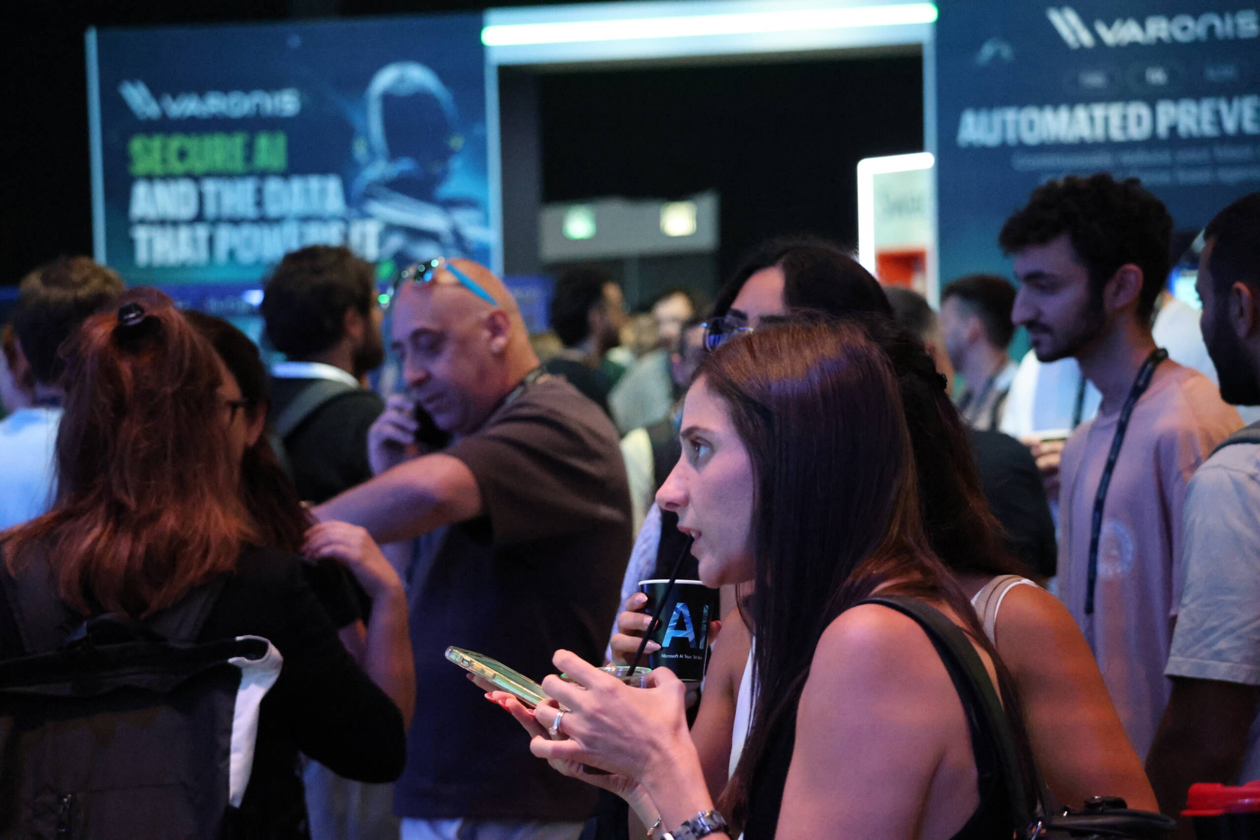 Attendees mingle near the Varonis booth at Microsoft AI Tour Tel Aviv