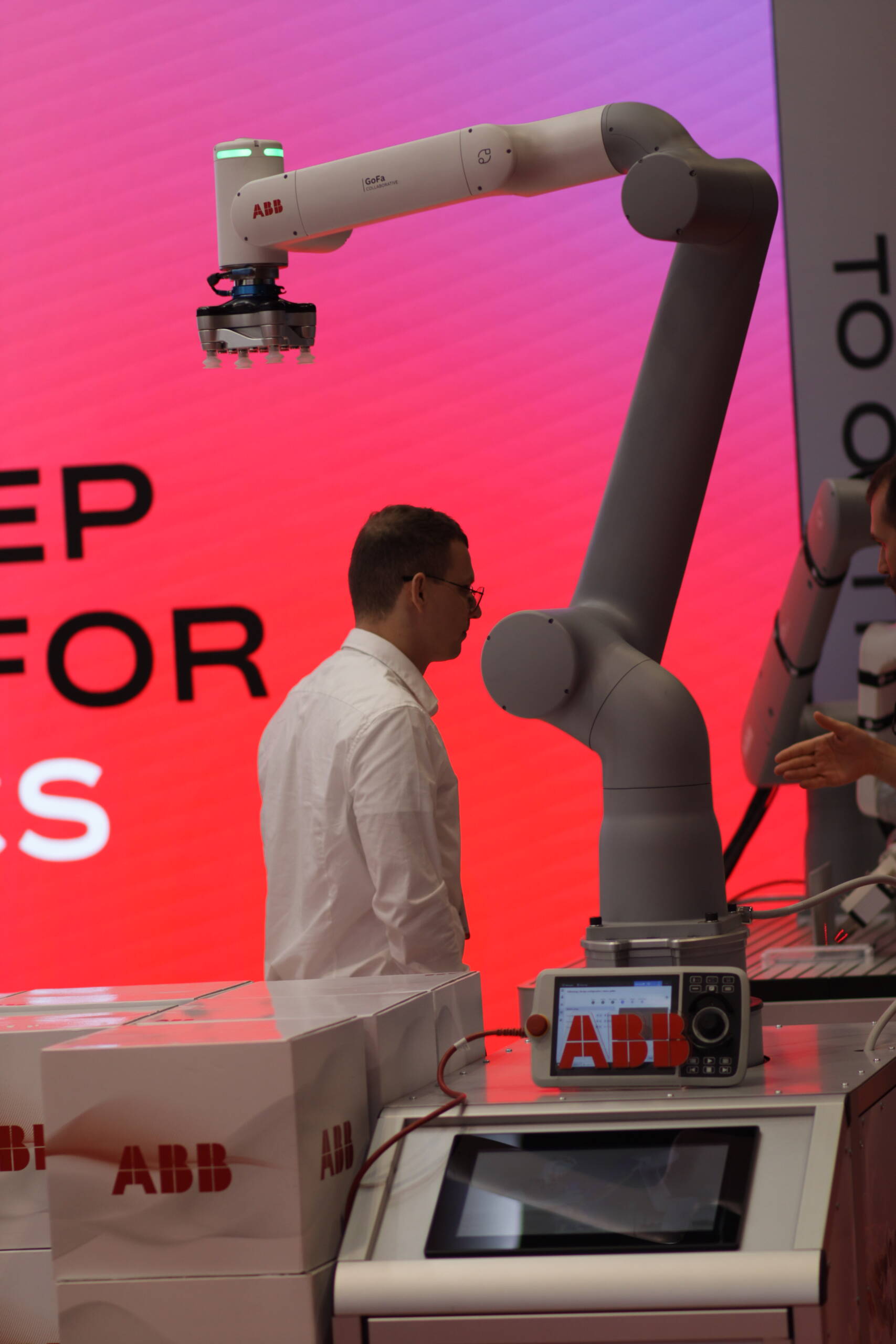 ABB GoFa collaborative robot demonstration at a trade show booth