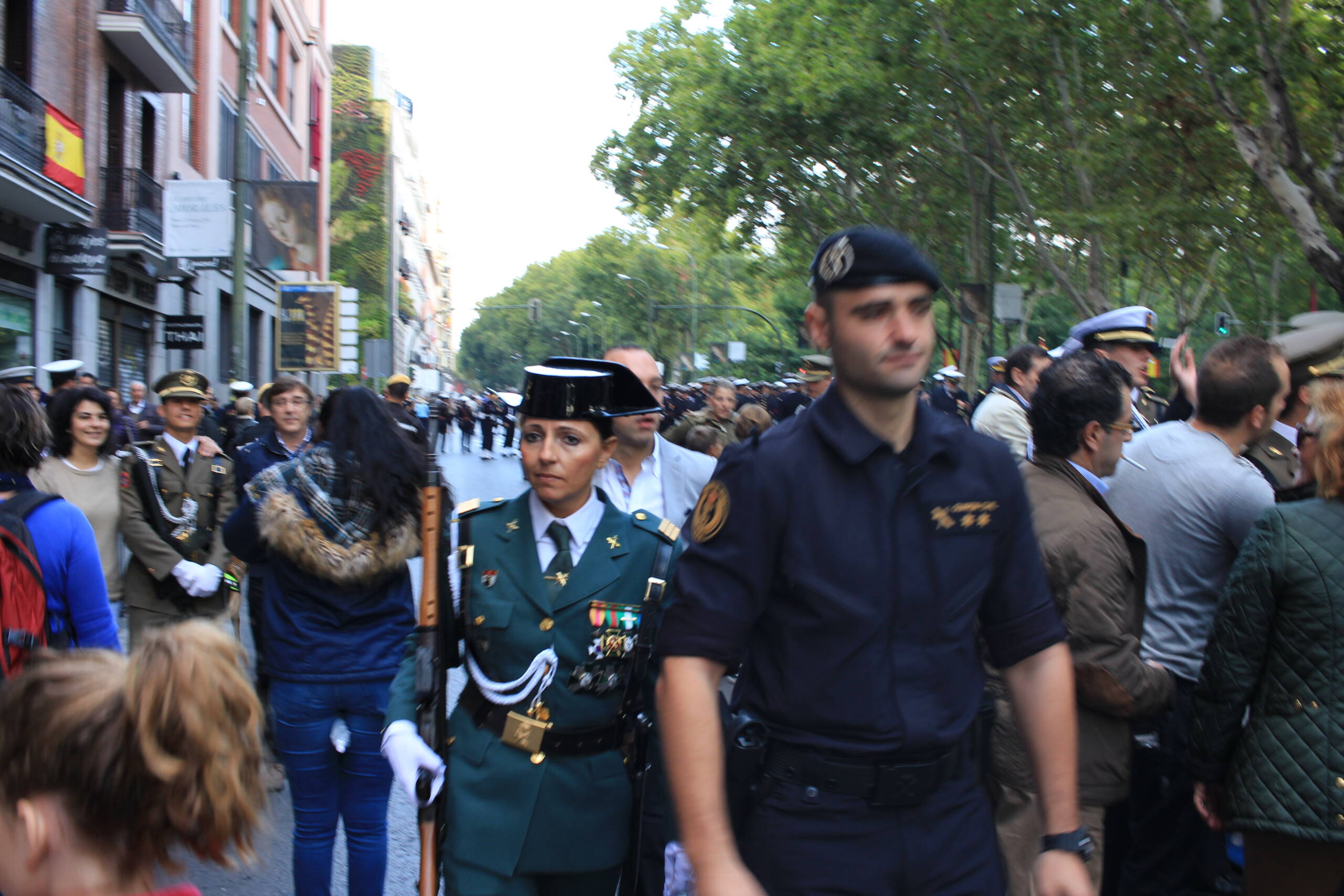 Guardia Civil and Policía Nacional officers on a Madrid street during a national day parade