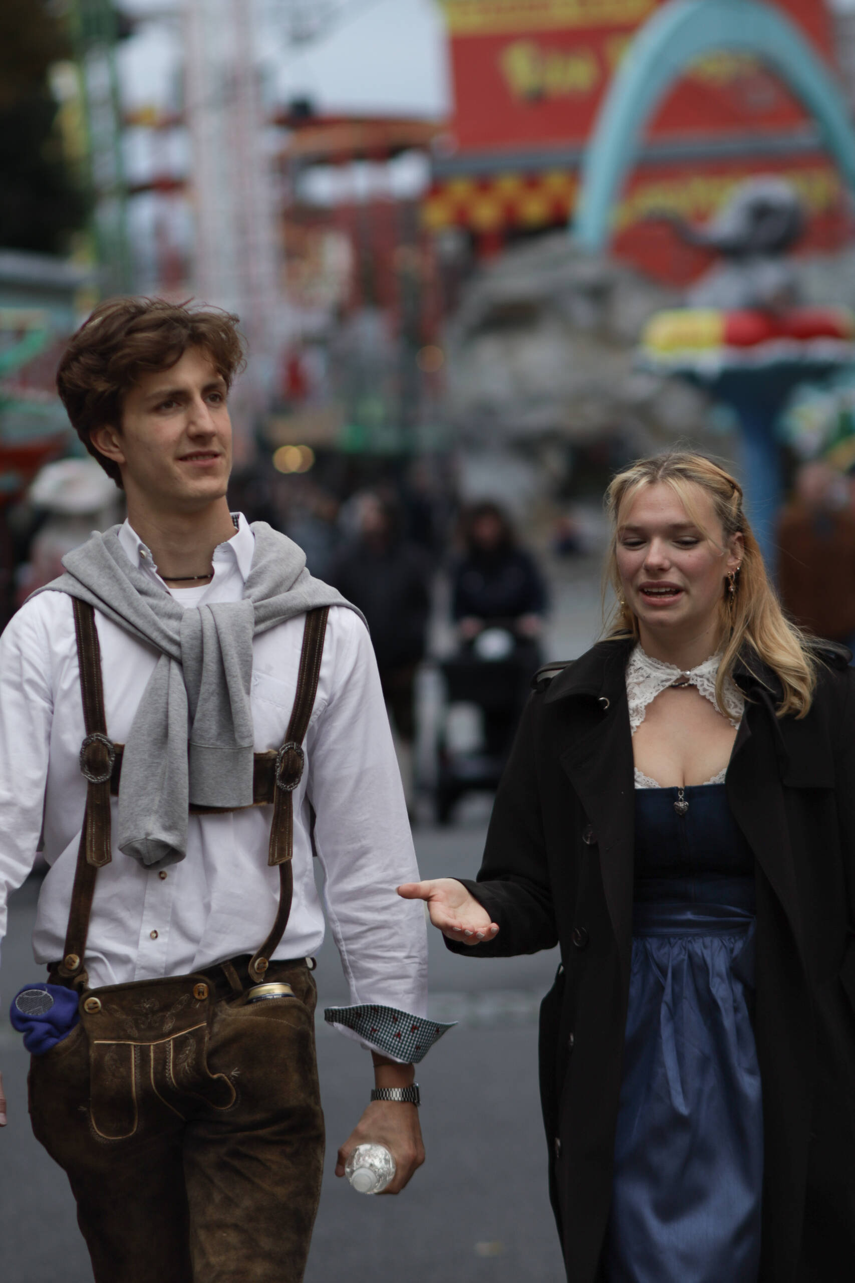 Couple in Tracht Walking the Midway, Oktoberfest Munich